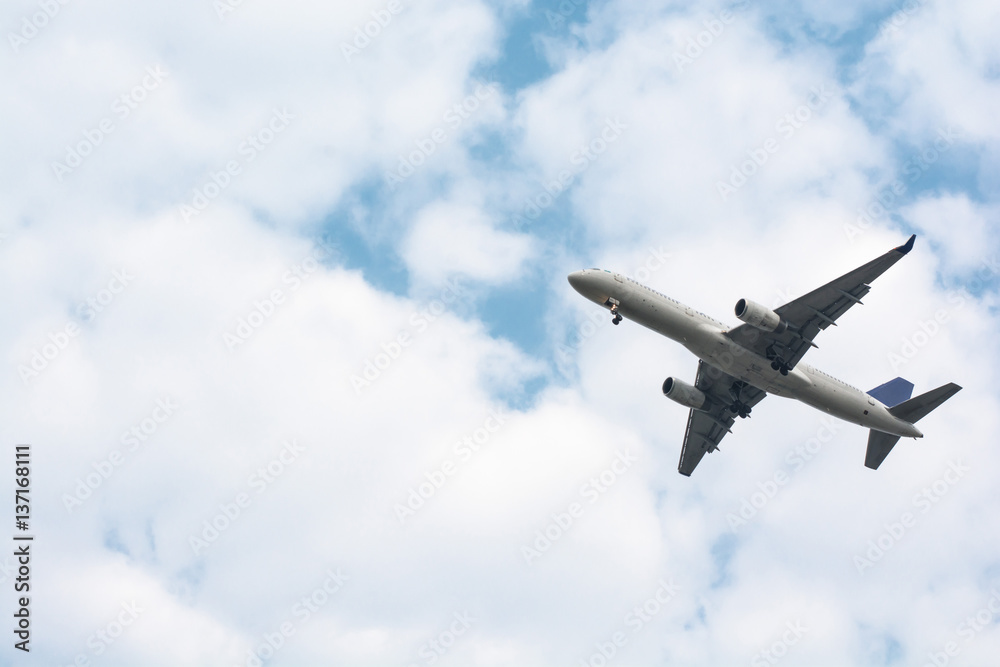 Fototapeta premium Airplane take-off from runways at cloudy sky.