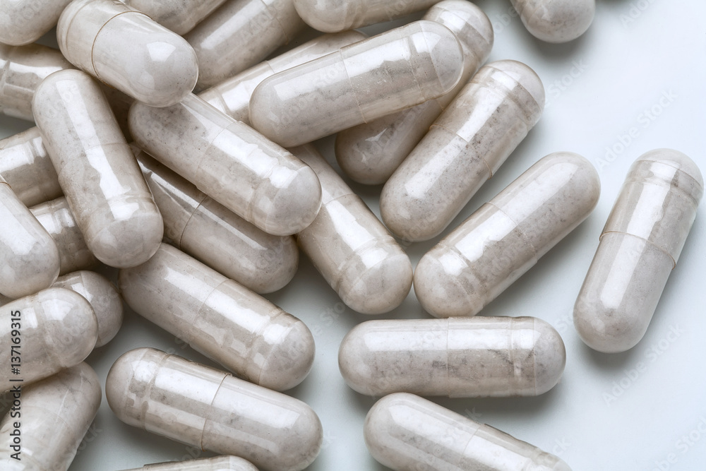 Close up pile of capsules probiotic powder inside. Top view, high resolution product.  Health care concept