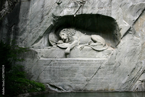 View to the Dying Lion monument. Carved in the rock to honor the Swiss Guards of Louis XIV of France in Lucerne, Switzerland