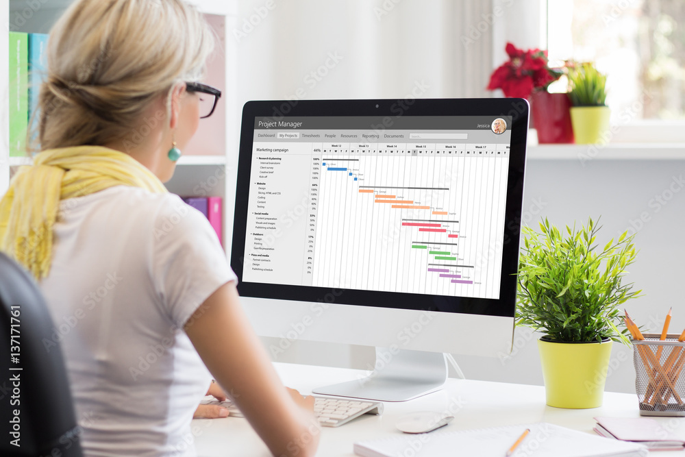 Woman using Gantt chart for project management Woman using Gantt chart for project management