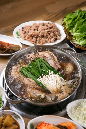 hanbang baeksuk. Boiled Chicken with Rice andMedicinal Herbs photo