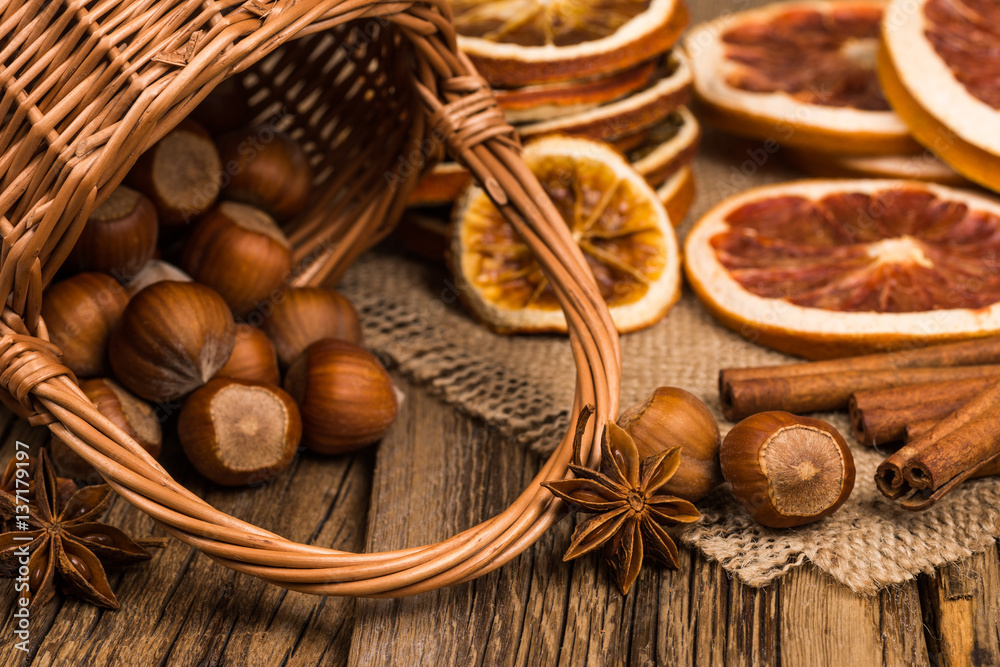 Hazelnuts in wicker basket on old wooden table. Hazelnuts in wicker basket on old wooden table.