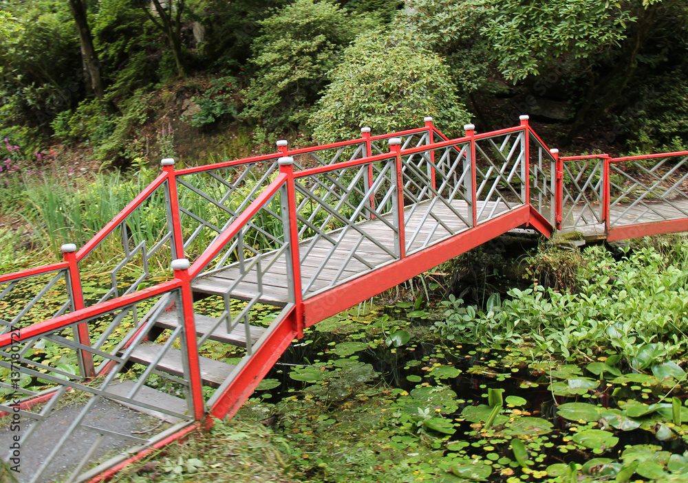 An Oriental Bridge in a Japanese Water Garden. An Oriental Bridge in a Japanese Water Garden.