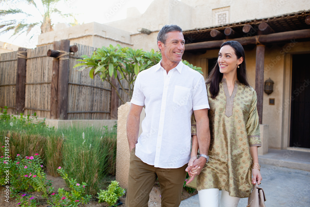 Couple walking outdoors. Couple walking outdoors.