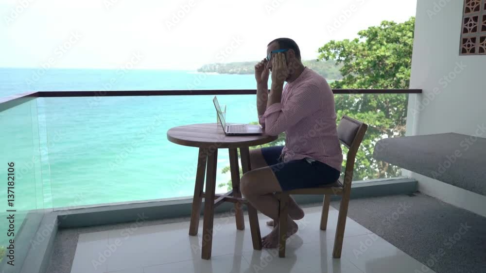 custom made wallpaper toronto digitalYoung man having head pain while working on laptop sitting on terrace