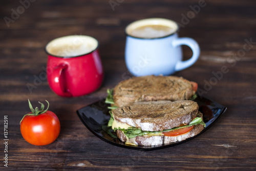 Breakfast, Whole wheat Sandwiches, tomato and coffee for two on wooden table