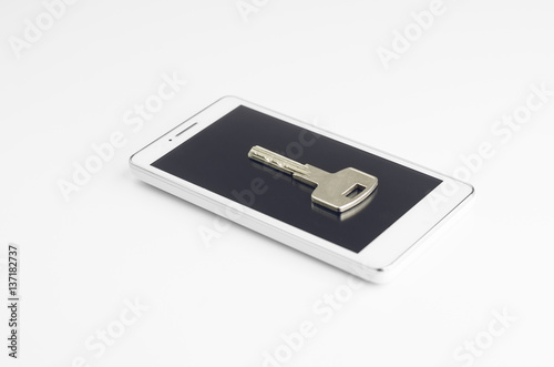 Wallpaper Mural Smartphone Security Concept. White Smartphone With Door Key On It On White Background Torontodigital.ca