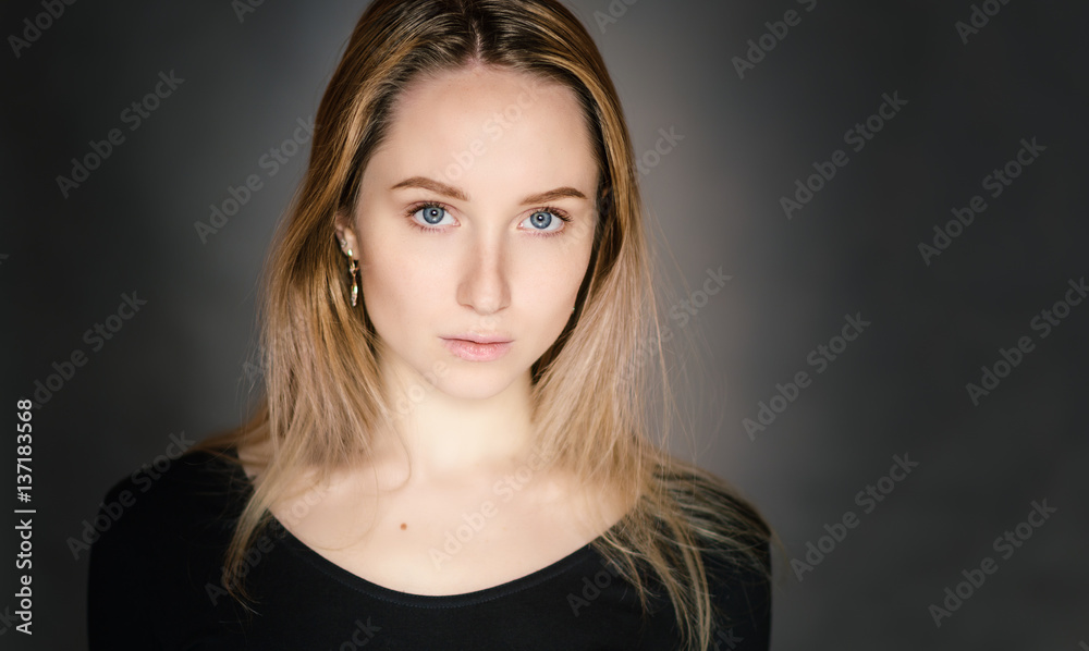 Portrait of a beautiful young woman with blue eyes. Portrait of a beautiful young woman with blue eyes.