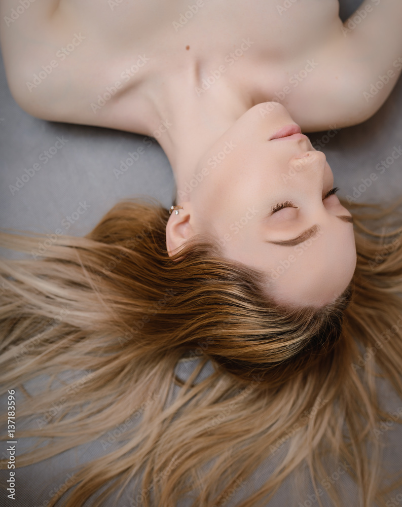 Beautiful hair. Top view of women with beautiful hair on dark background. Beautiful hair. Top view of women with beautiful hair on dark background.
