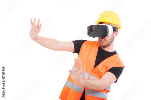 Male builder wearing futuristic vr glasses