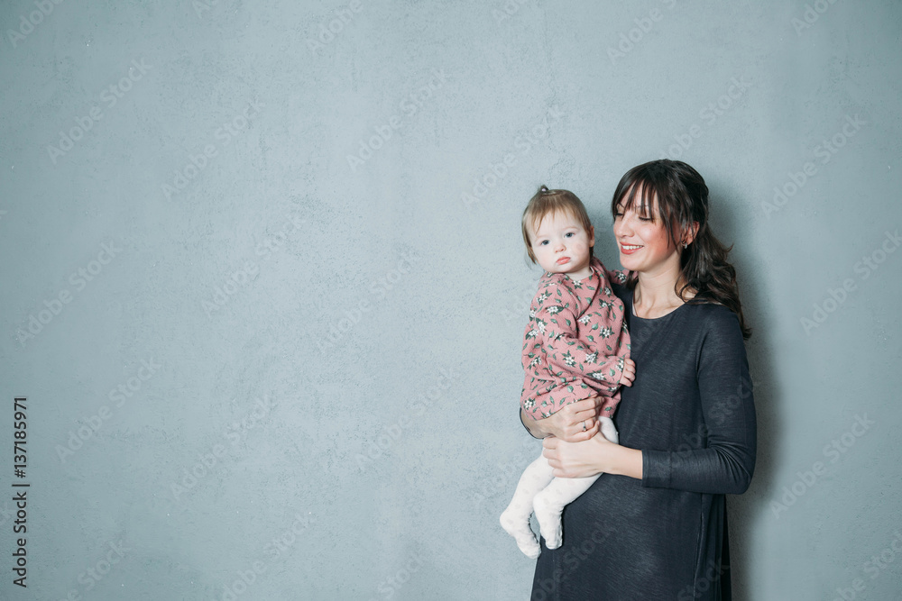 Mother with cute daughter portrait keep baby on hands Mother with cute daughter portrait keep baby on hands