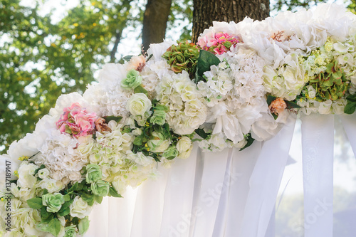 Element wedding arches of white and pink flowers close-up