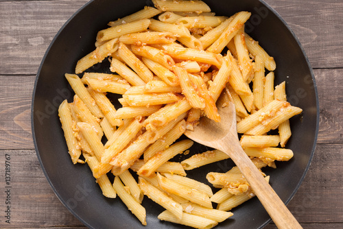Penne pasta with tomato sauce in a pan