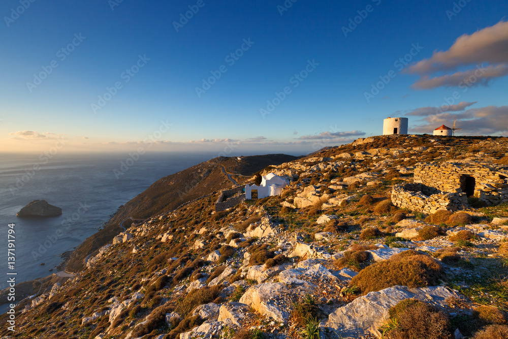 Windmills on the coast of Amorgos island early in the morning.