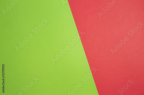 Greenery and red colored paper background