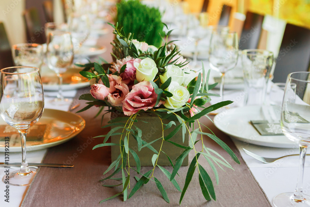 Served wedding table with flowers decorations Served wedding table with flowers decorations