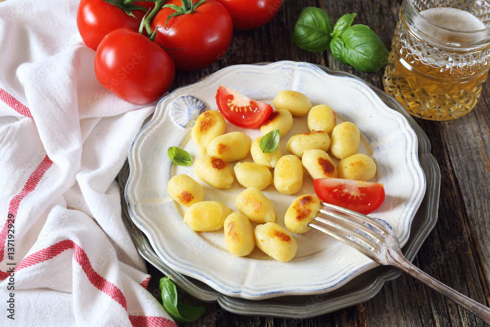 Fried potato gnocchi with cheese and tomatoes Fried potato gnocchi with cheese and tomatoes