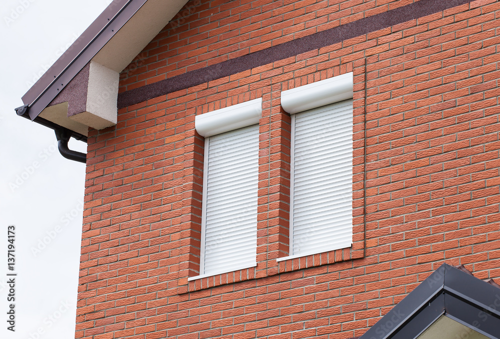 Modern private house with jalousie on windows Modern private house with jalousie on windows
