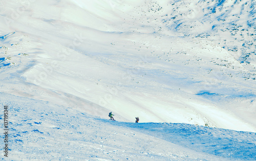 skier and snowboarder freeride in mountains