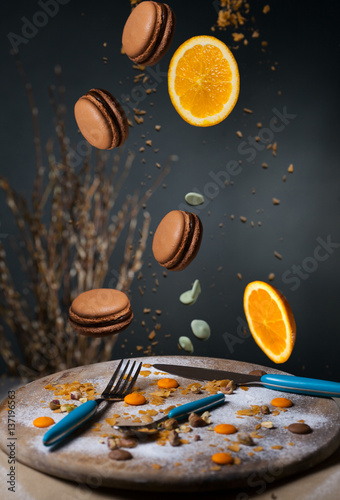 cakes, makaruns fall on a wooden tray photo