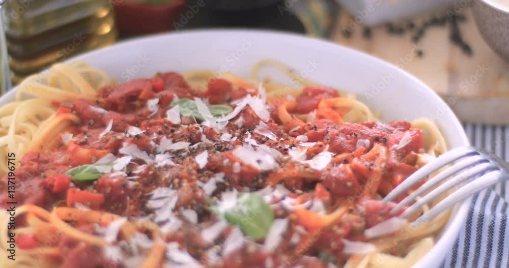 Dolly push in view of Italian pasta (spaghetti, linguine) with tomato sauce Dolly push in view of Italian pasta (spaghetti, linguine) with tomato sauce