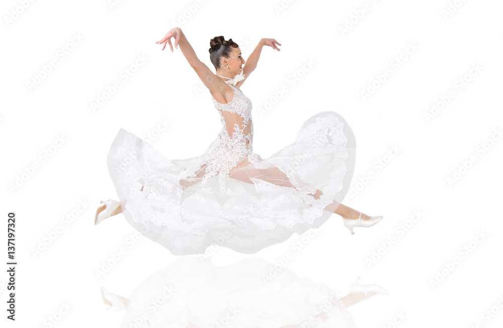 Naklejka premium pretty smiling woman in wedding dress jump isolated on white