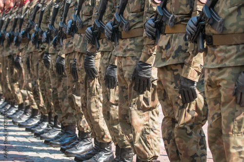 Army parade - armed soldiers in camouflage military uniform