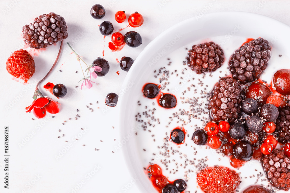 Yogurt with chia seeds and frozen berries. Yogurt with chia seeds and frozen berries.