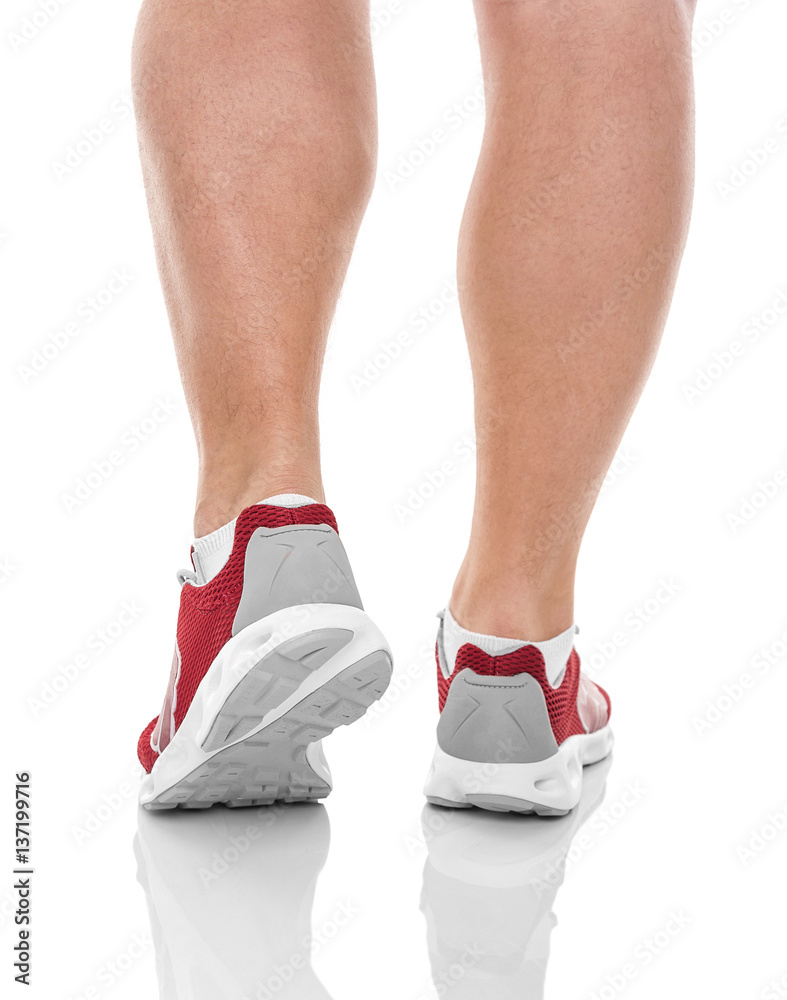 Men's sports legs in sneakers. Men's sports legs in sneakers.