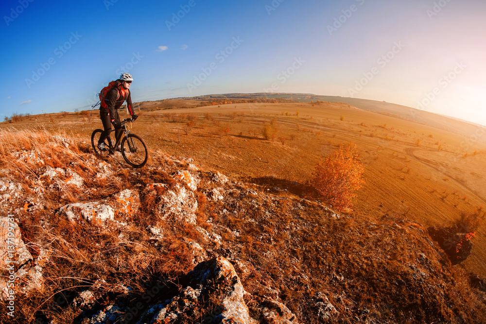 Mountain biker riding on bike at summer mountains. inspiration in beautiful inspirational landscape. Mountain biker riding on bike at summer mountains. inspiration in beautiful inspirational landscape.
