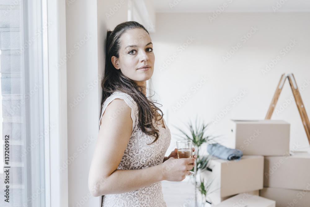 Mature businesswoman moving into her new home Mature businesswoman moving into her new home