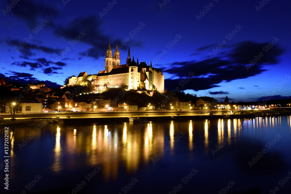 Albrechts castle in Meissen / Germany at night with reflections in the Elbe river