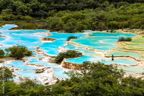 Huanglong National Park, Sichuan, China, famous for its colorful pools formed by calcite deposits. Multi-colored Pond in the picture is the world's largest cluster of open air ponds, 3576m elevation