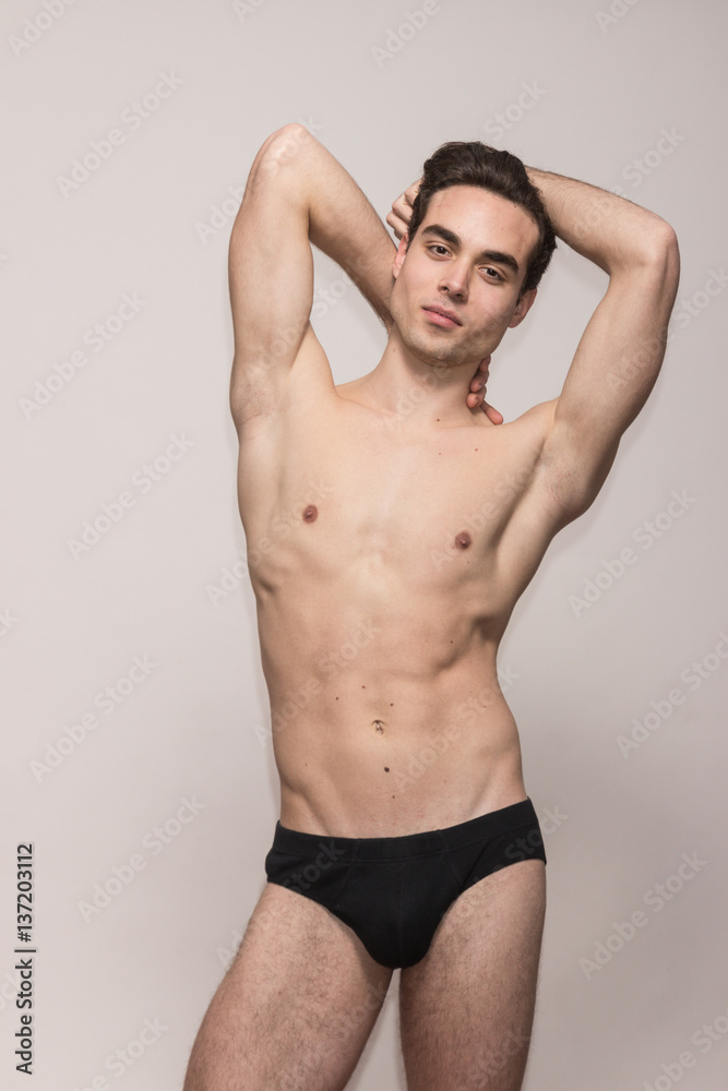 young man model arms raised young man model arms raised