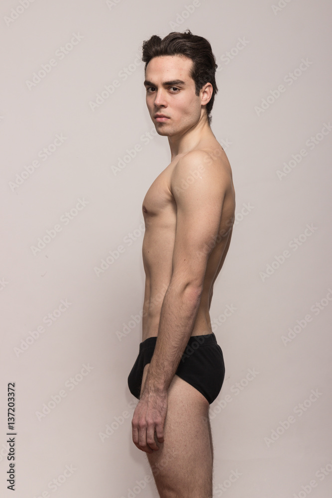 young man model posing shirtless body fit slim