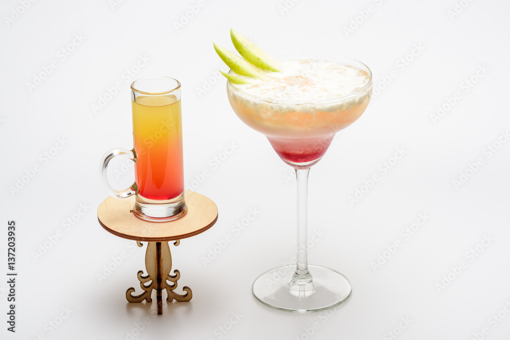 cocktails: sex on the beach and margarita on decorative table cocktails: sex on the beach and margarita on decorative table