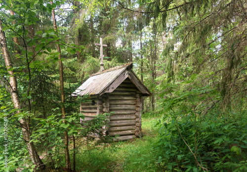 Russian wooden chapel in the forest © fotomm2
