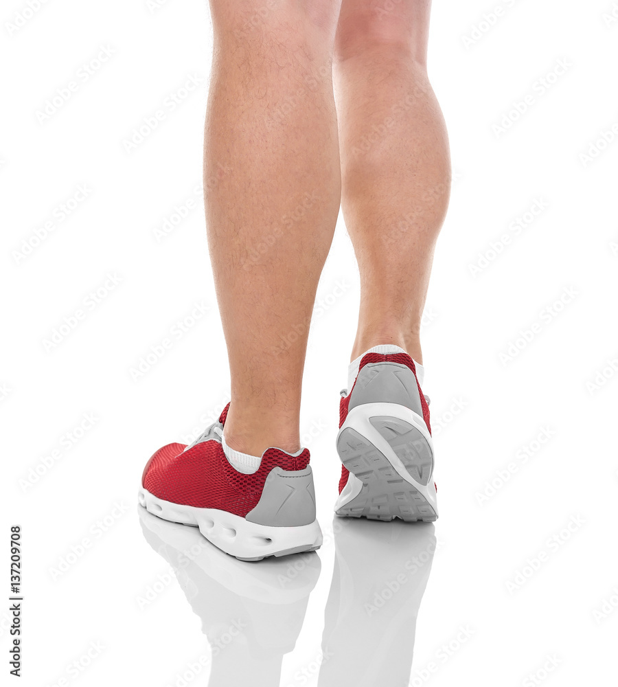 Men's sports legs in sneakers. Men's sports legs in sneakers.