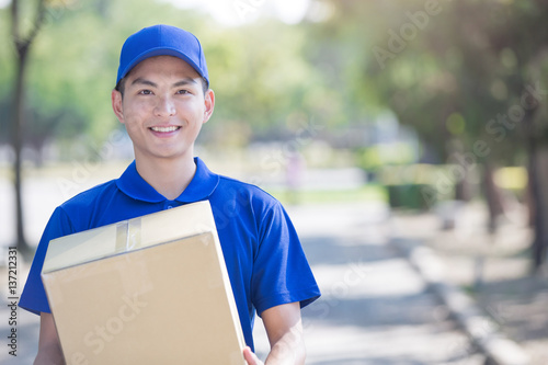 deliveryman stand and smile photo