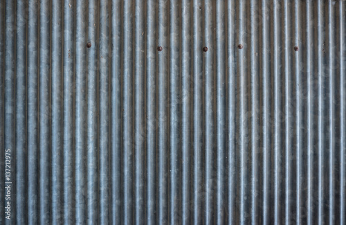 Rusty corrugated metal texture. Old zinc sheet.