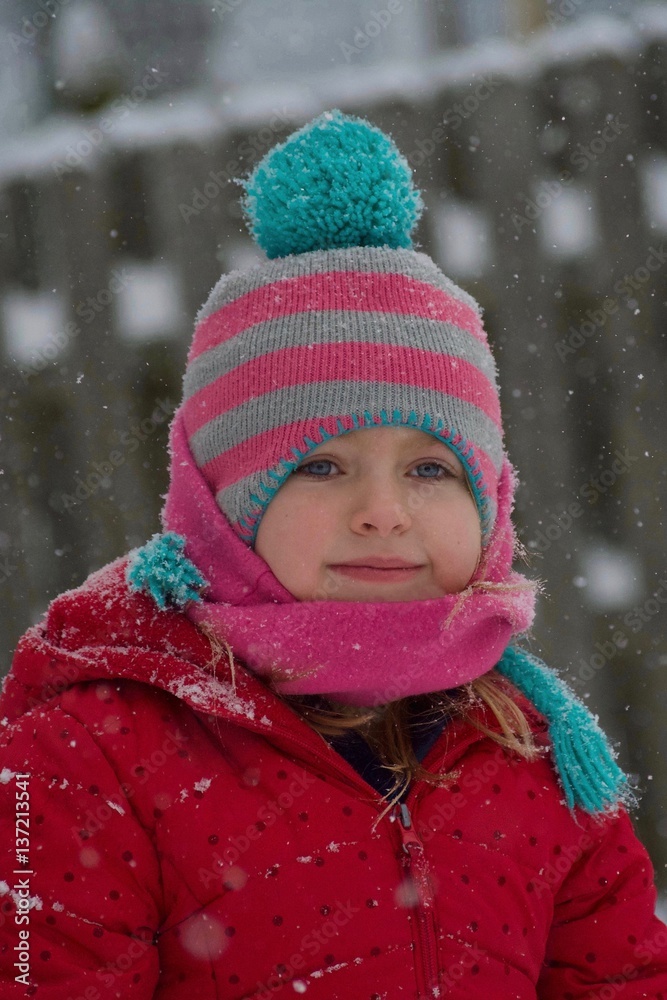 adorable school age girl smiling wearing winter hat scarf and jacket in snow adorable school age girl smiling wearing winter hat scarf and jacket in snow