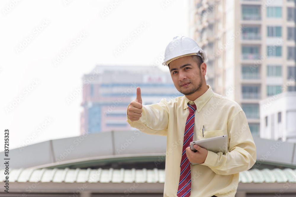 Business man thumbs thumb A confident stance, with the backdrop of the buildings in the city. Business man thumbs thumb A confident stance, with the backdrop of the buildings in the city.