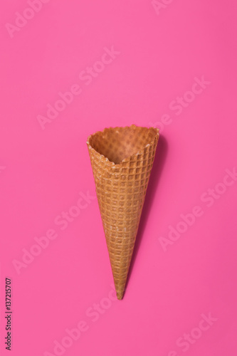 Empty waffle cup on a pink background
