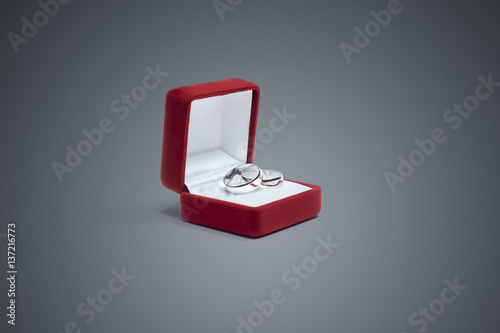 wedding rings and jewelry box on a wooden table
