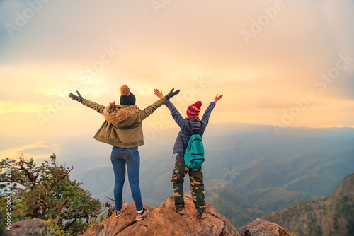 Hiker woman feeling victorious facing on the mountain, Thailand