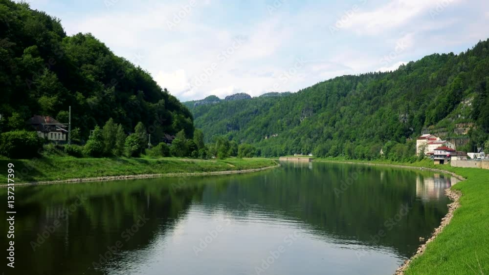 A river in a rural area, woods on the sides A river in a rural area, woods on the sides