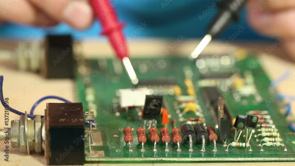 technician diagnoses the circuit board components. technician diagnoses the circuit board components.
