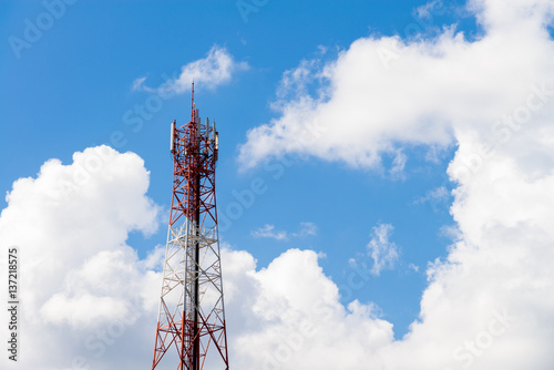 Telecommunication towers with Blue sky and white clouds background and texture