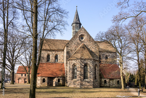 Germany, Brandenburg, Jüterbog: Side view and park of Zinna Abbey church (Kloster Zinna). The abbey is a former Cistercian monastery, about 60 km (37 miles) south of Berlin. photo