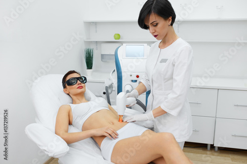 Beautiful Woman Receiving Beauty Treatment. Laser Procedures.